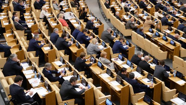 Депутаты на пленарном заседании Государственной Думы РФ. Архивное фото Депутаты на пленарном заседании Государственной Думы РФ. Архивное фото