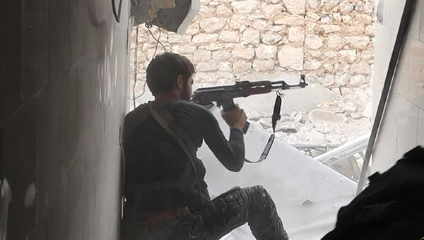 Боевик Исламского государства в Сирии. Архивное фото Боевик Исламского государства в Сирии. Архивное фото