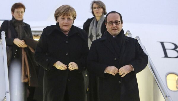 Канцлер Германии Ангела Меркель и президент Франции Франсуа Олланд в аэропорту Минска Канцлер Германии Ангела Меркель и президент Франции Франсуа Олланд в аэропорту Минска