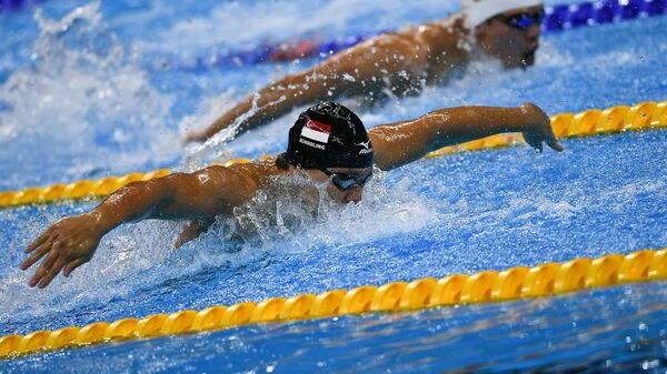 Сингапурский пловец Джозеф Скулинг в финальном заплыве на 100 м баттерфляем на XXXI летних Олимпийских играх