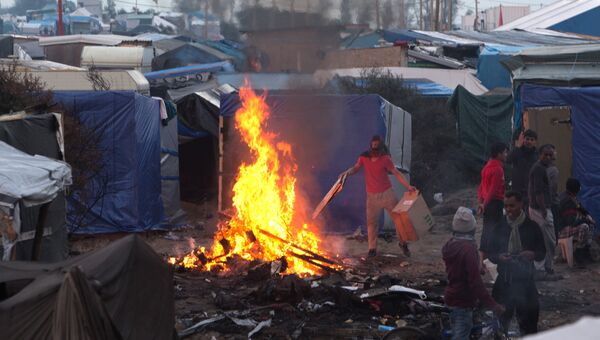 Беженцы в лагере Джунгли в Кале во Франции, 25 октября 2016 Беженцы в лагере Джунгли в Кале во Франции, 25 октября 2016
