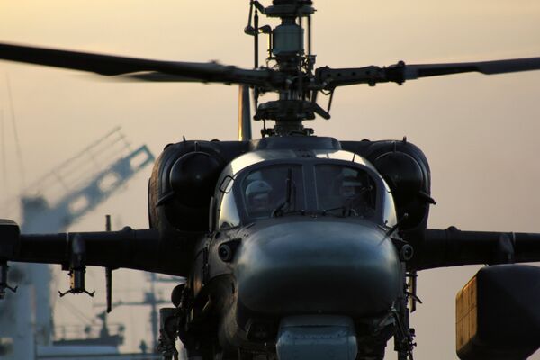 Вертолет Ка-52К взлетает с палубы тяжелого авианесущего крейсера Адмирал Кузнецов в Средиземном море Вертолет Ка-52К взлетает с палубы тяжелого авианесущего крейсера Адмирал Кузнецов в Средиземном море