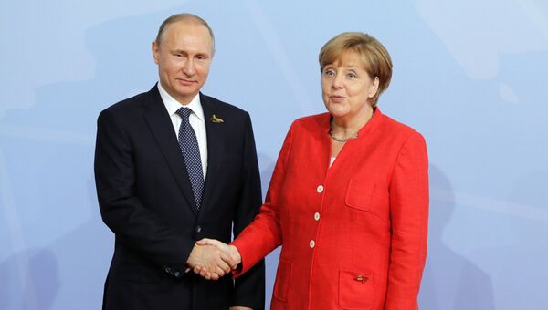 Президент РФ Владимир Путин и канцлер Германии Ангела Меркель. Архивное фото Президент РФ Владимир Путин и канцлер Германии Ангела Меркель. Архивное фото