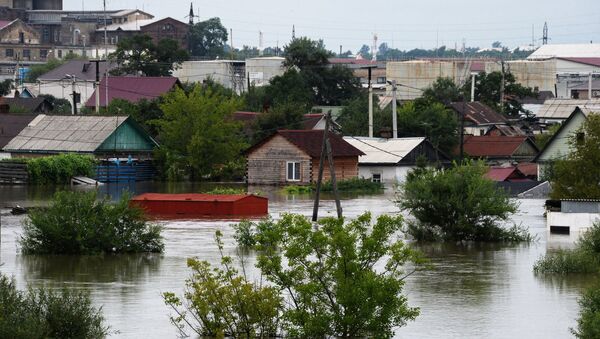 Здания, затопленные в результате наводнения, в Уссурийске. Архивное фото Здания, затопленные в результате наводнения, в Уссурийске. Архивное фото
