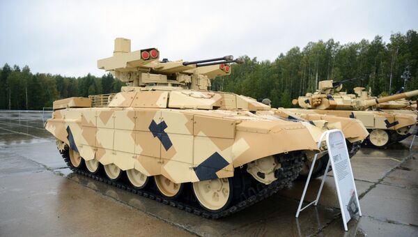 Боевая машина огневой поддержки, выполненная на базе шасси танка Т-72 (БМПТ) Терминатор на выставке приуроченной к празднованию Дня Танкиста на полигоне Старатель в Нижнем Тагиле. Боевая машина огневой поддержки, выполненная на базе шасси танка Т-72 (БМПТ) Терминатор на выставке приуроченной к празднованию Дня Танкиста на полигоне Старатель в Нижнем Тагиле.