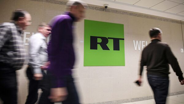 Сотрудники в офисе телеканала RT в Москве Сотрудники в офисе телеканала RT в Москве