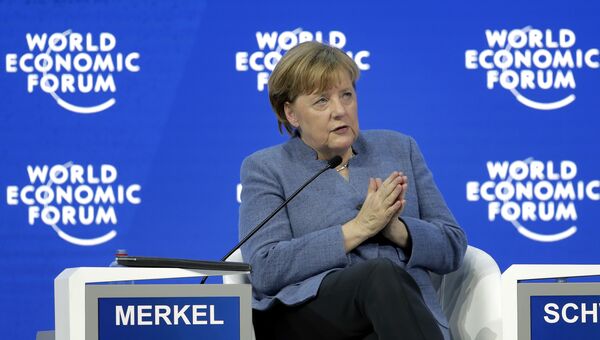 Канцлер Германии Ангела Меркель выступает в рамках ежегодного заседания Всемирного экономического форума в Давосе, Швейцария. 24 января 2018 Канцлер Германии Ангела Меркель выступает в рамках ежегодного заседания Всемирного экономического форума в Давосе, Швейцария. 24 января 2018