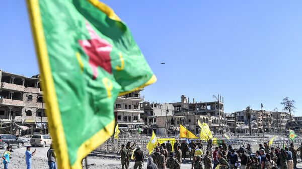 Бойцы отряда народной самообороны курдов (YPG). Архивное фото Бойцы отряда народной самообороны курдов (YPG). Архивное фото