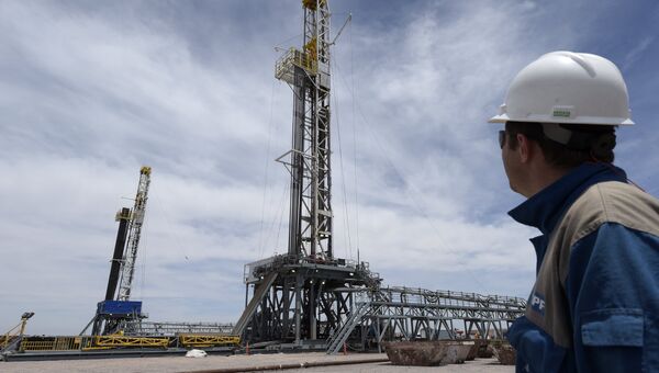 Drilling rigs at Vaca Muerta shale oil field in Argentina Drilling rigs at Vaca Muerta shale oil field in Argentina