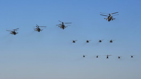 Ударные вертолеты Ка-52 Аллигатор (на первом плане) во время репетиции воздушной части парада Победы Ударные вертолеты Ка-52 Аллигатор (на первом плане) во время репетиции воздушной части парада Победы