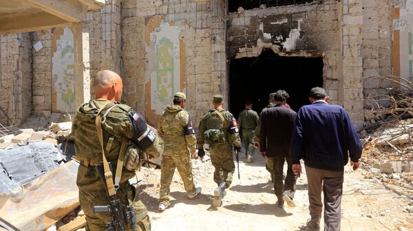 Военнослужащие российской военной полиции в городе Дума. архивное фото Военнослужащие российской военной полиции в городе Дума. архивное фото