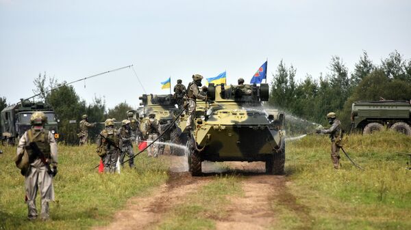 Военнослужащие вооруженных сил Украины и армейских подразделений иностранных государств во время активной фазы военных учений Репид Трайдент - 2018 Военнослужащие вооруженных сил Украины и армейских подразделений иностранных государств во время активной фазы военных учений Репид Трайдент - 2018