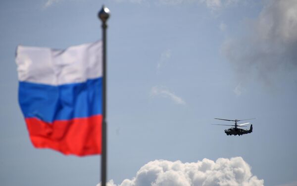 Российский разведывательно-ударный вертолёт Ка-52 Аллигатор выполняет демонстрационный полет на Международном авиационно-космическом салоне МАКС-2019 в подмосковном Жуковском Российский разведывательно-ударный вертолёт Ка-52 Аллигатор выполняет демонстрационный полет на Международном авиационно-космическом салоне МАКС-2019 в подмосковном Жуковском