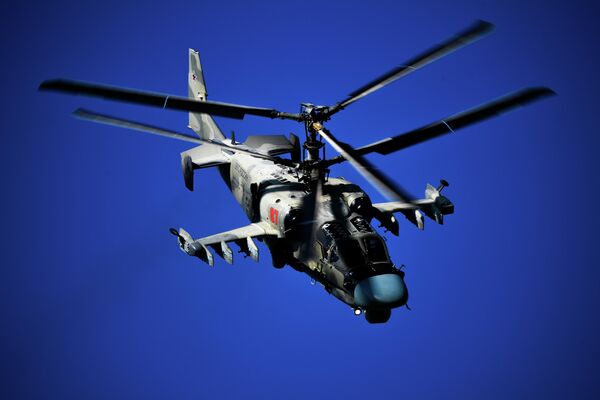 Вертолет Ка-52 выполняет полет на Международном авиационно-космическом салоне МАКС-2019 Вертолет Ка-52 выполняет полет на Международном авиационно-космическом салоне МАКС-2019