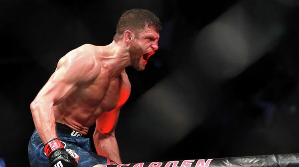 BOSTON, MA - JANUARY 20: Calvin Kattar celebrates his win by TKO against Shane Burgos in their Featherweight fight during UFC 220 at TD Garden on January 20, 2018 in Boston, Massachusetts.   Mike Lawrie/Getty Images/AFP