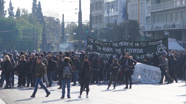 Демонстранты во время акции протеста в Афинах, Греция. 6 декабря 2019 Демонстранты во время акции протеста в Афинах, Греция. 6 декабря 2019